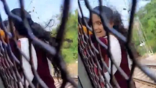 Women Hanging Onto Train: రైల్లో యువతి ఫుట్ బోర్డింగ్.. షాకింగ్ వీడియో