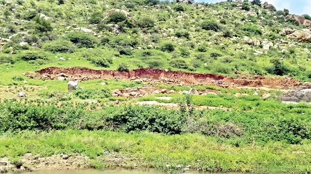 కొండను తవ్వేస్తున్నారు..!