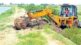 అక్రమ చేపల చెరువుల ధ్వంసం