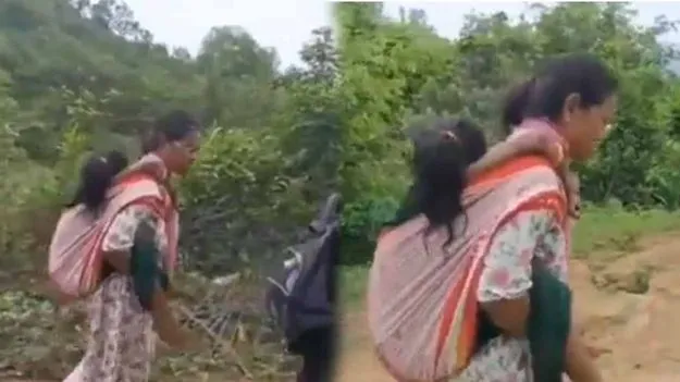 విధి నిర్వహణలో మానవత్వం.. భుజాన మోసి బాలిక ప్రాణం కాపాడిన వార్డెన్