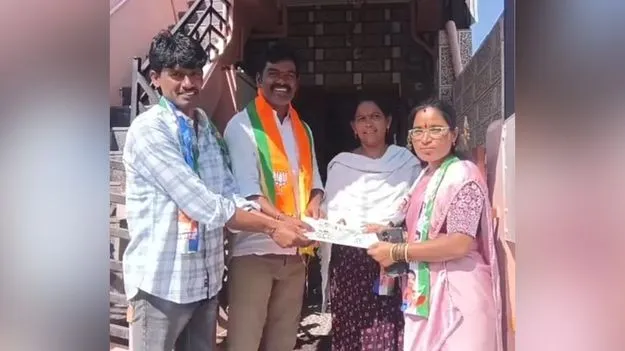 బీజేపీ అభ్యర్థి ఇంటికి వైసీపీ అభ్యర్థి!