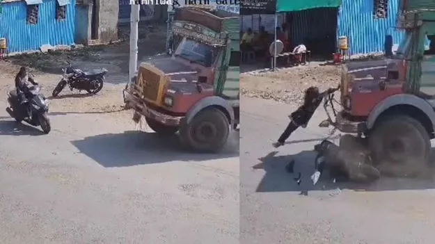 స్కూటీని ఢీకొట్టిన ట్రక్కు.. ప్రాణాలతో బయటపడిన యువతి..